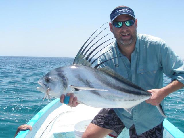 Angler with roosterfish using Stripping Guards